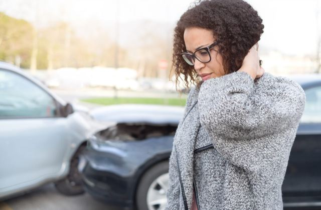 Person with neck pain after an auto accident
